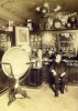 116.     ERDÉLYI, (MÓR) : [Ferenc Hopp (1833-1919) optician, collector, museum founder, traveller, in his shop among his staff (Calderoni and Co.)], cca. 1910.