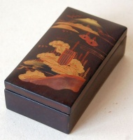 Vintage japanese lacquer box with mountain Fuji and landscape motif on the top. 